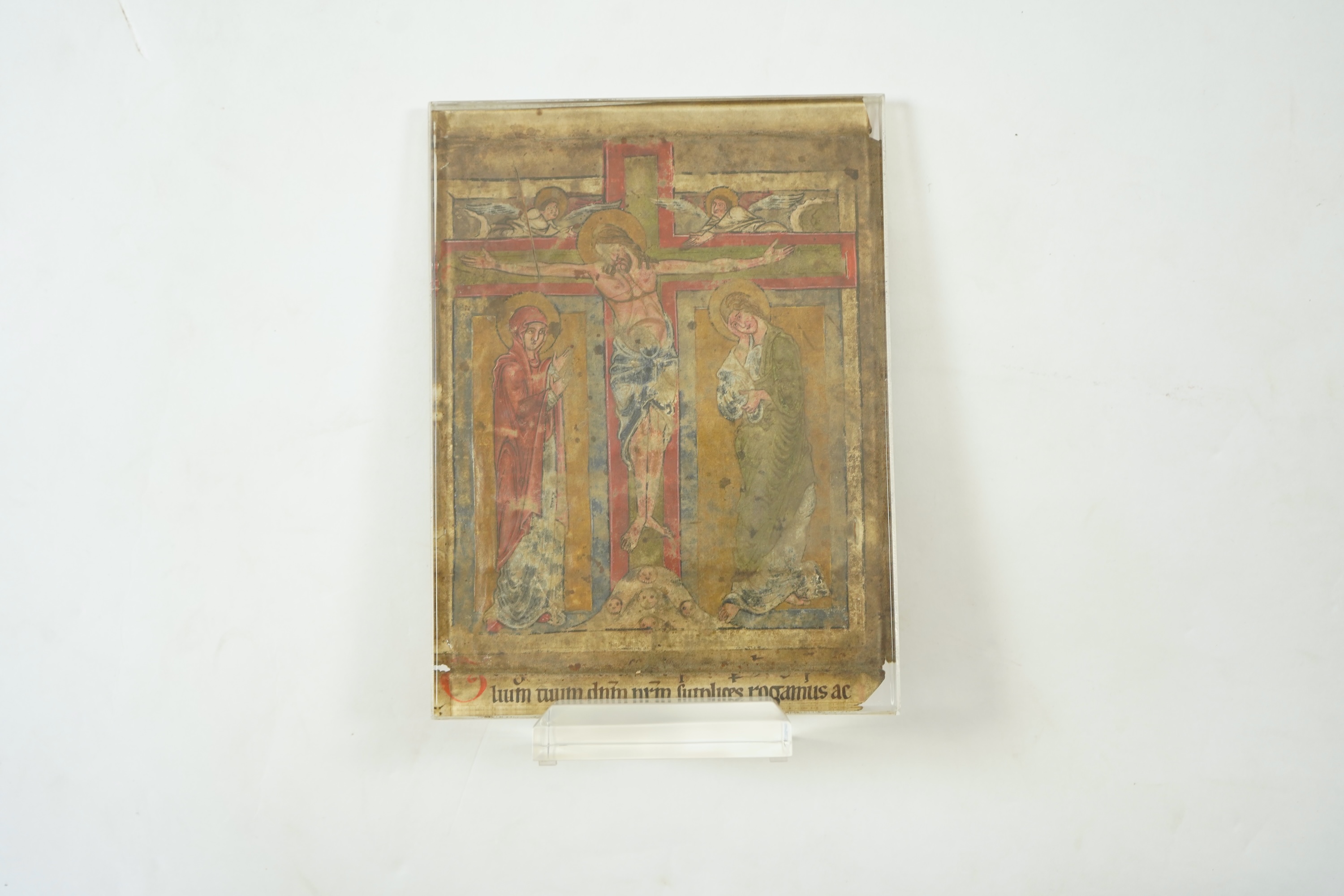 An illuminated leaf from a missal at the Canon, with Crucifixion scene, the reverse inscribed with the Te igitur, probably Austria or South German, second half 12th century